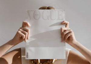 Woman Holding Vogue