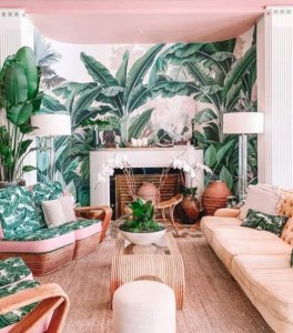 a living room full of plants and patterned furniture